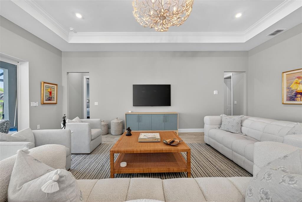 26532 Key Sands Street Englewood, FL 34223 - Photo 28 of 97 a living room with furniture and a flat screen tv