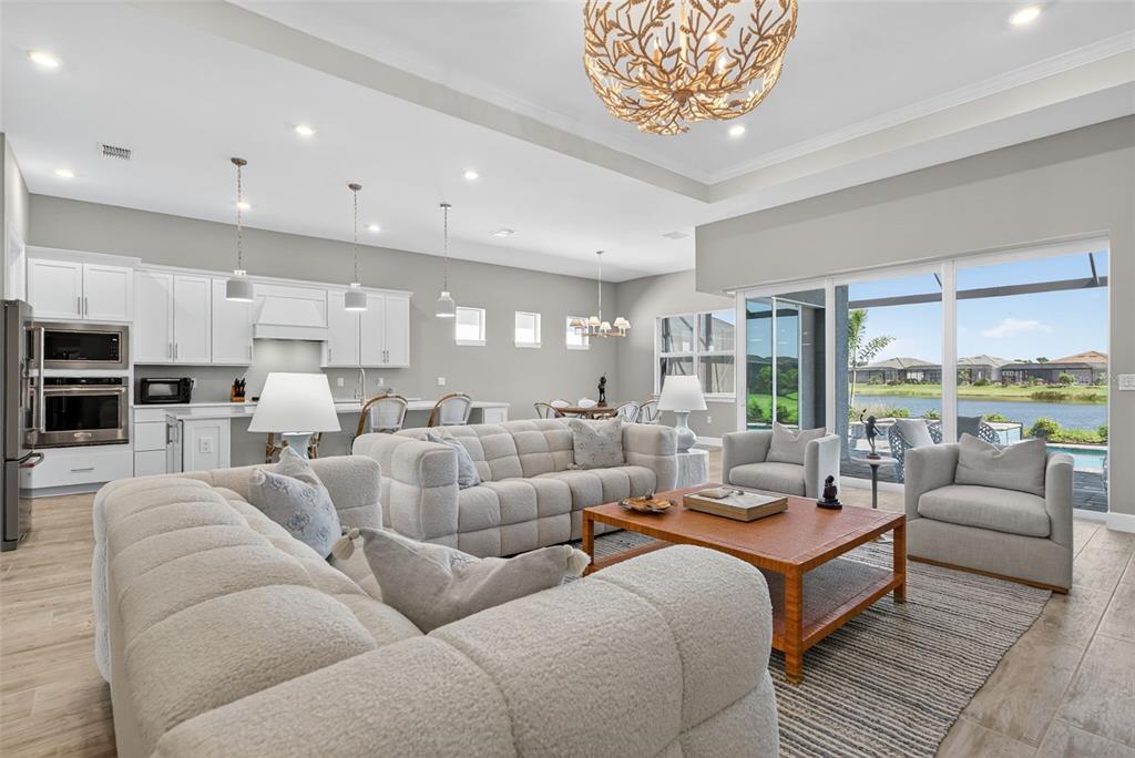 26532 Key Sands Street Englewood, FL 34223 - Photo 31 of 97 a living room with furniture and a large window