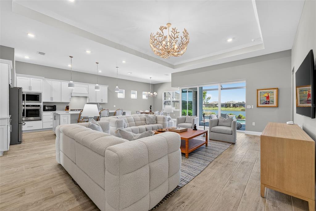 26532 Key Sands Street Englewood, FL 34223 - Photo 32 of 97 a living room with furniture kitchen view and a large window
