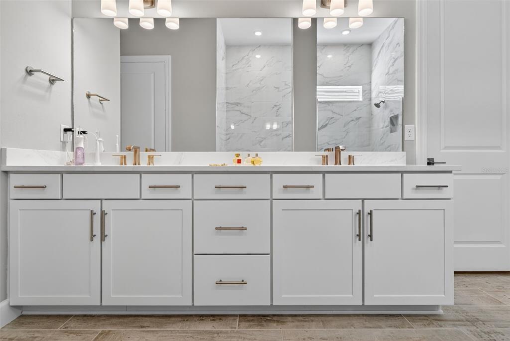 26532 Key Sands Street Englewood, FL 34223 - Photo 39 of 97 a bathroom with a sink and a mirror