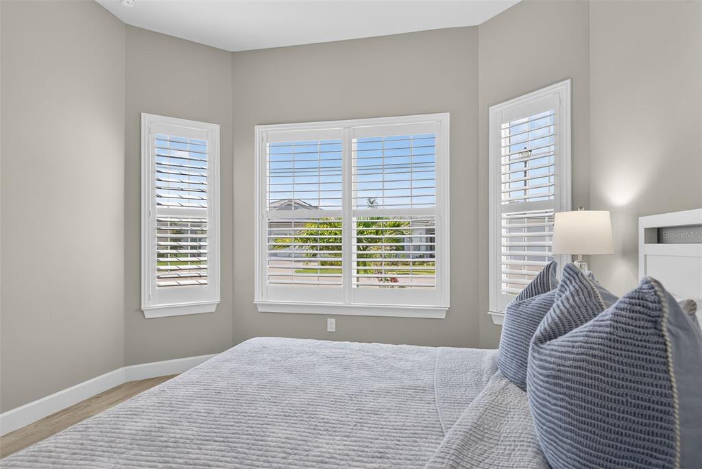 26532 Key Sands Street Englewood, FL 34223 - Photo 49 of 97 a bedroom with a bed and a large window