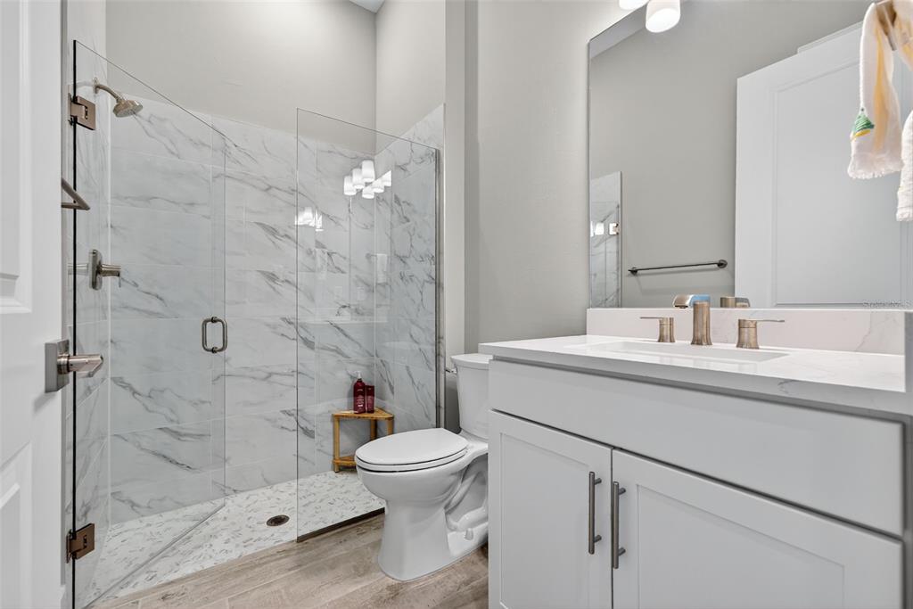 26532 Key Sands Street Englewood, FL 34223 - Photo 51 of 97 a bathroom with a sink toilet and shower