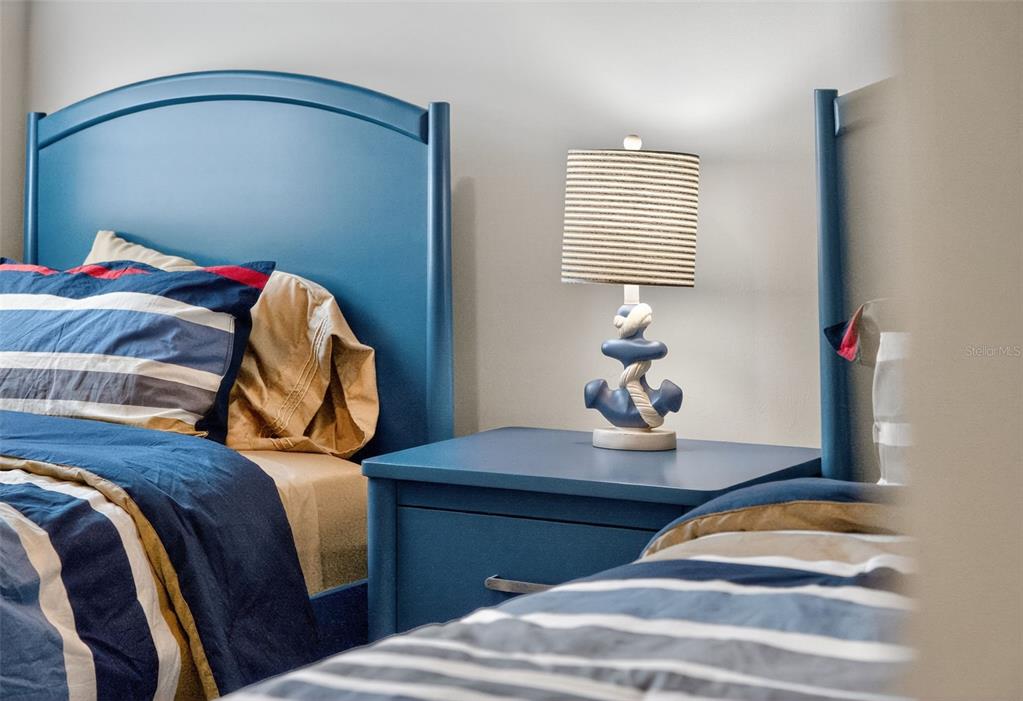 26532 Key Sands Street Englewood, FL 34223 - Photo 53 of 97 a bedroom with a bed and a lamp