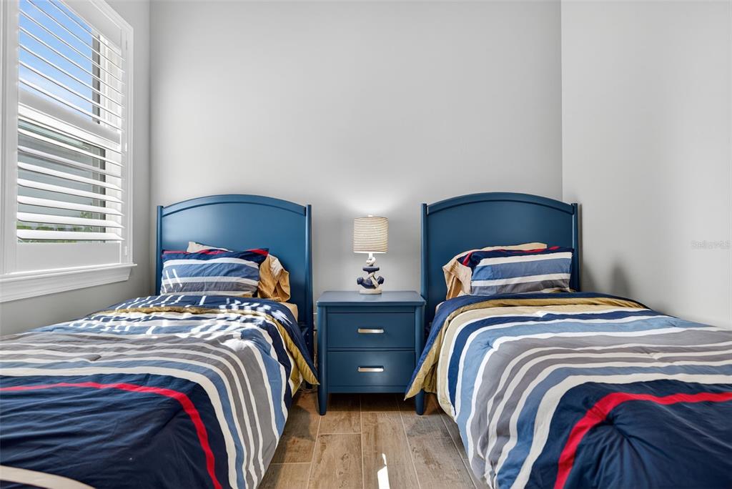 26532 Key Sands Street Englewood, FL 34223 - Photo 54 of 97 a bedroom with two beds and a window