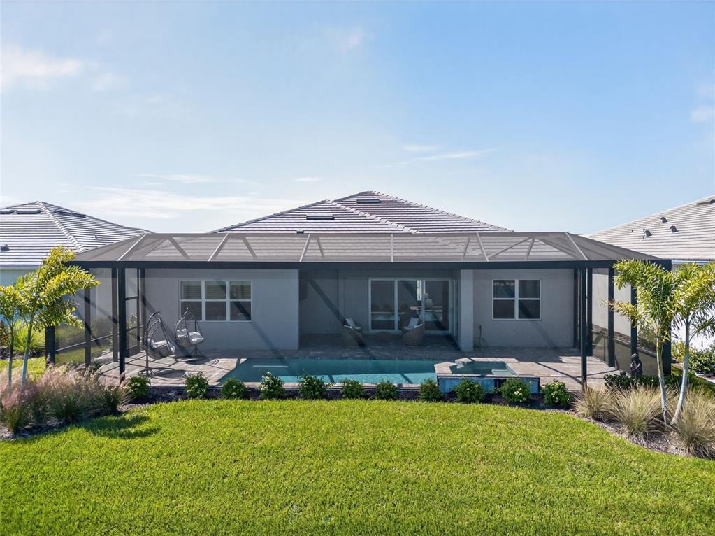 26532 Key Sands Street Englewood, FL 34223 - Photo 74 of 97 a front view of house with yard and outdoor seating