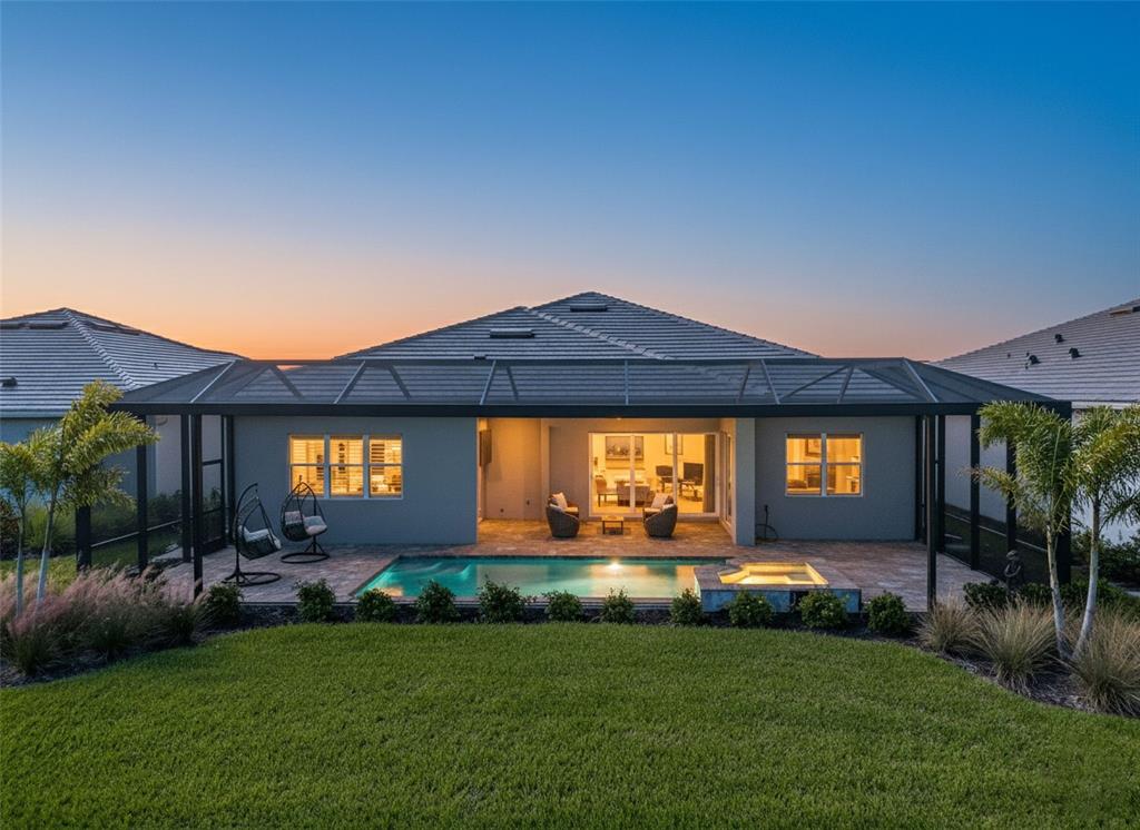 26532 Key Sands Street Englewood, FL 34223 - Photo 75 of 97 a front view of a house with a garden and yard