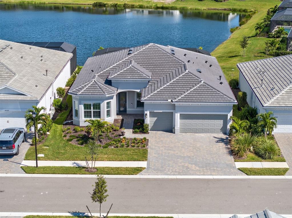 26532 Key Sands Street Englewood, FL 34223 - Photo 9 of 97 front view of a house with a yard