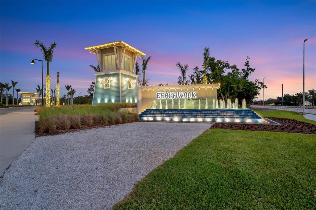 26532 Key Sands Street Englewood, FL 34223 - Photo 96 of 97 a view of a garden with a building in the background