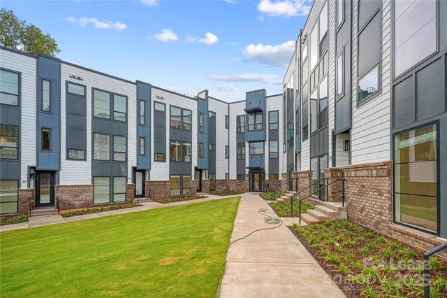 a view of a brick buildings with many windows