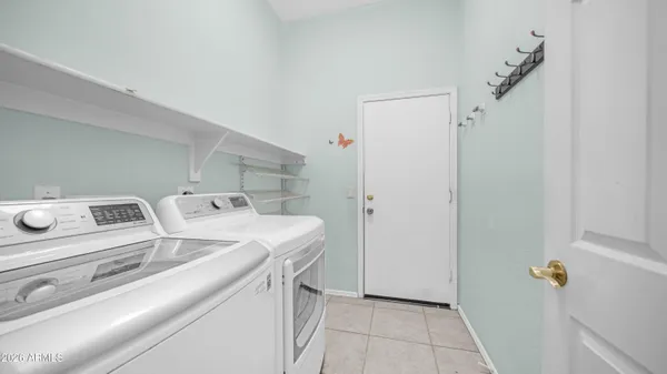 a bathroom with a tub shower and sink