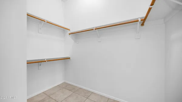 a bathroom with a tub sink double and mirror
