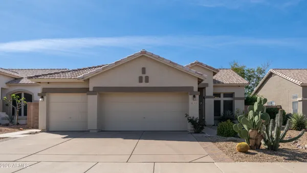 a front view of a house with a garage