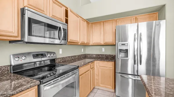 a kitchen with a sink and a large window