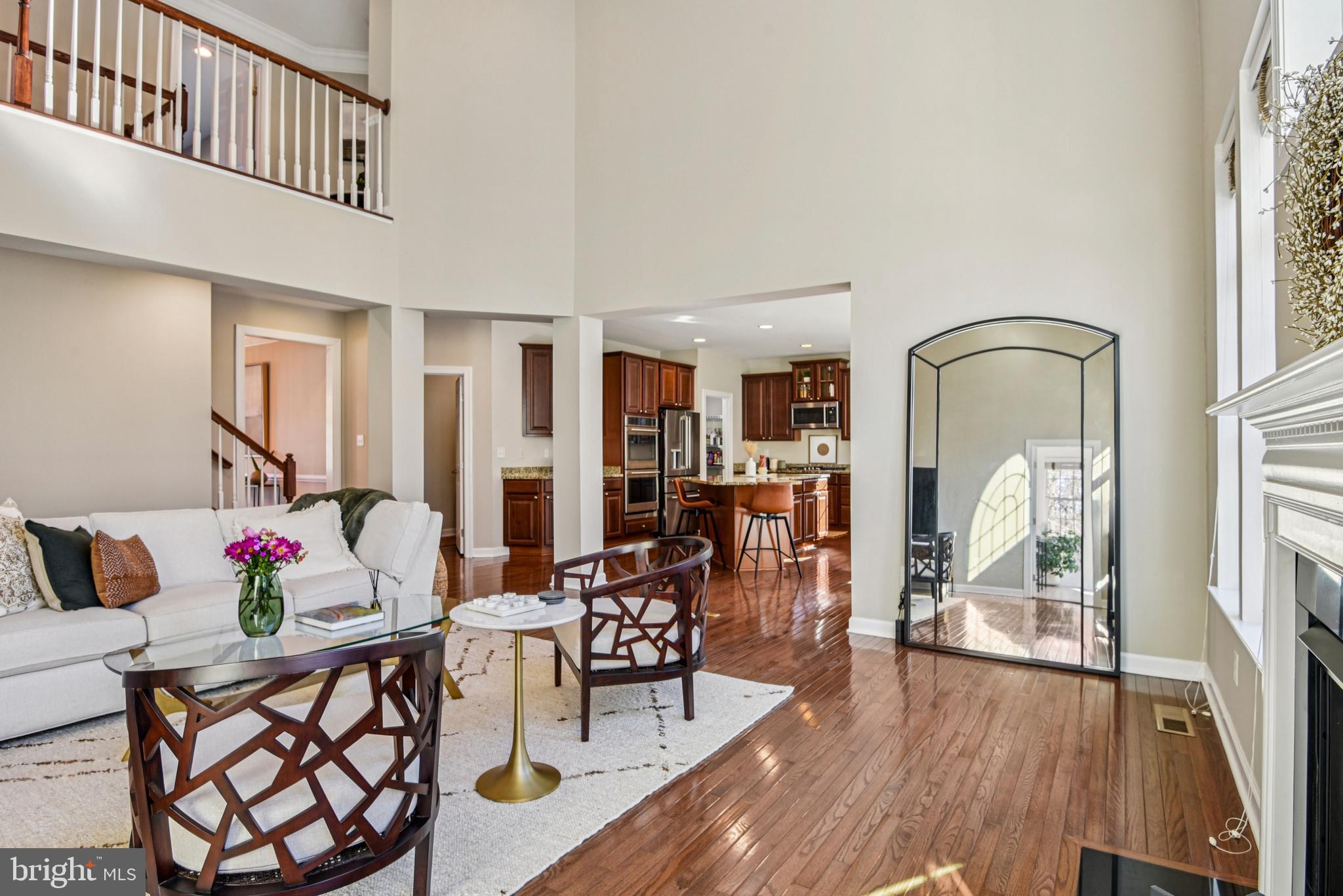 1705 Wolcott Way Hanover, MD 21076 - Photo 15 of 67 a living room with furniture dining table and wooden floor