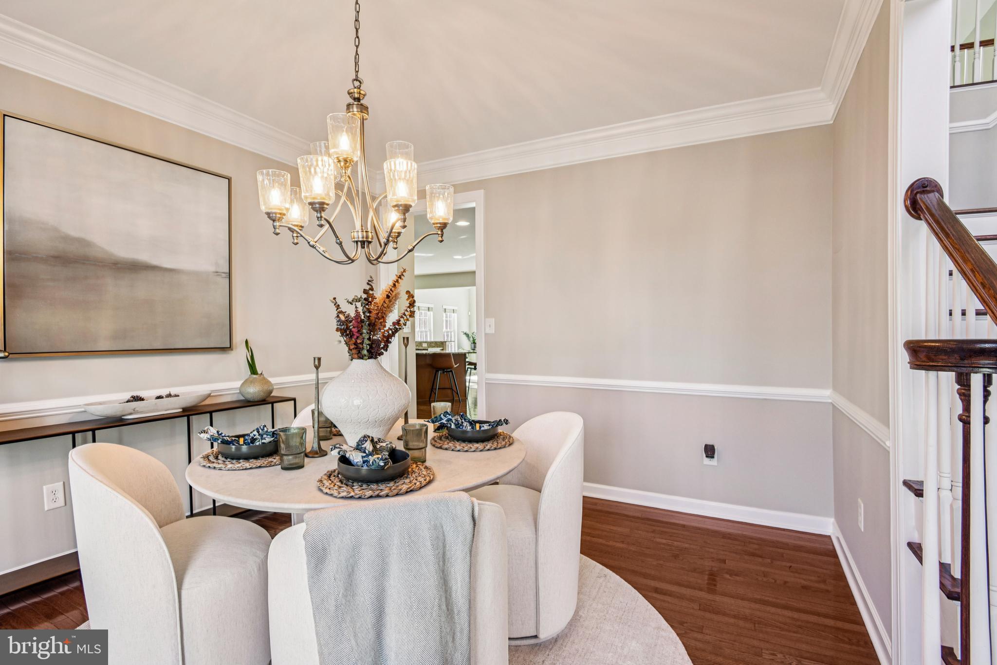 1705 Wolcott Way Hanover, MD 21076 - Photo 17 of 67 a view of a dining room with furniture and a chandelier