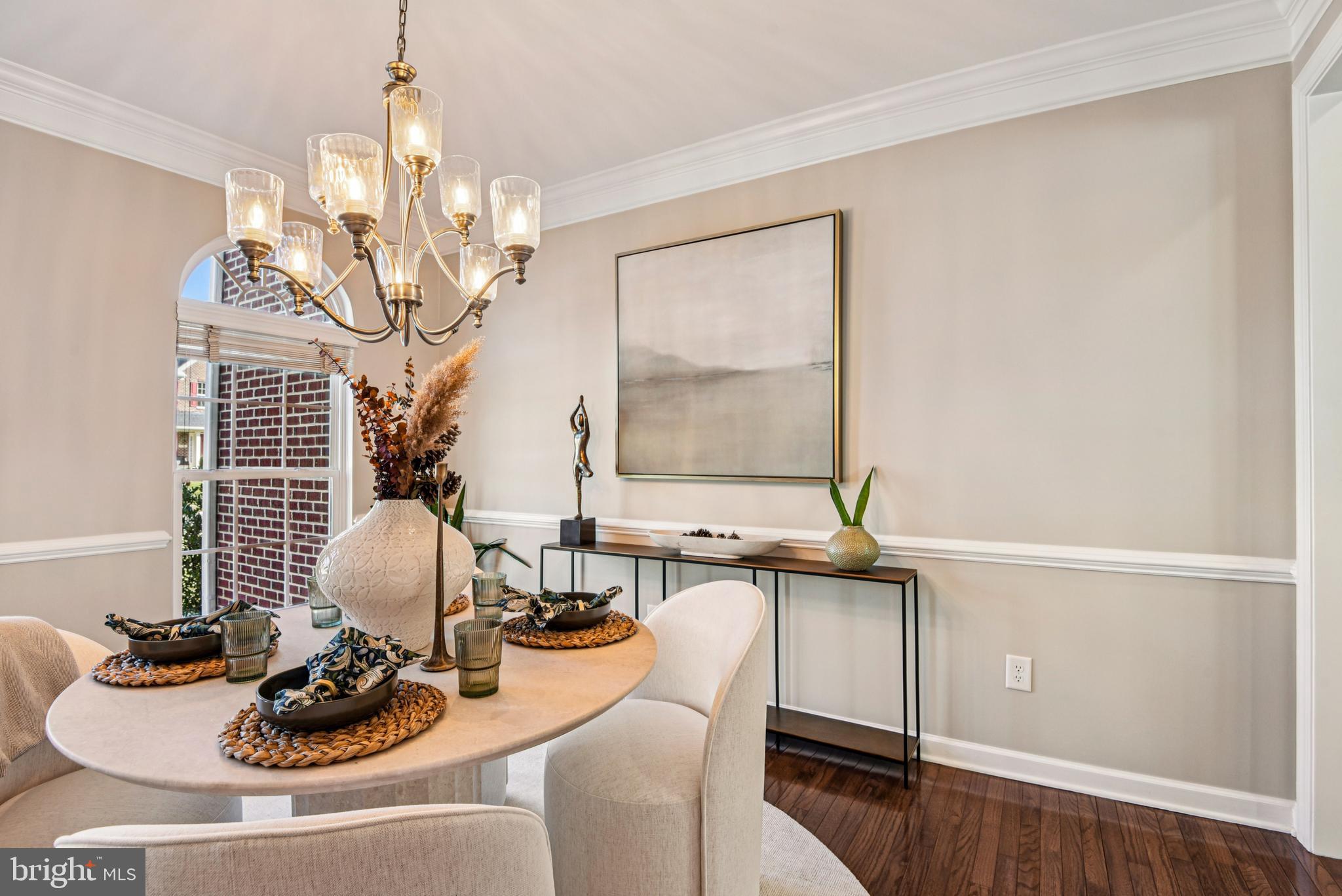 1705 Wolcott Way Hanover, MD 21076 - Photo 19 of 67 a room with furniture a chandelier and wooden floor