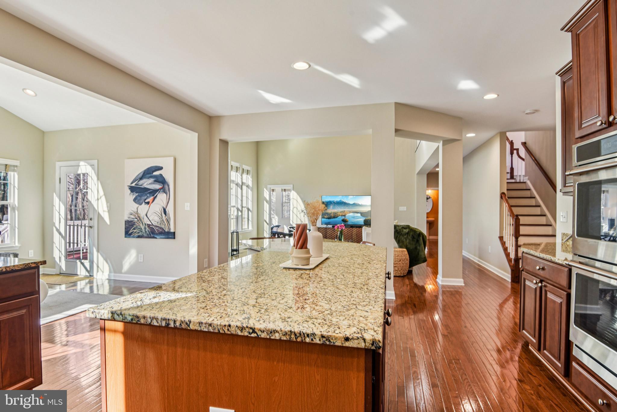 1705 Wolcott Way Hanover, MD 21076 - Photo 22 of 67 a kitchen with stainless steel appliances granite countertop a sink and a refrigerator
