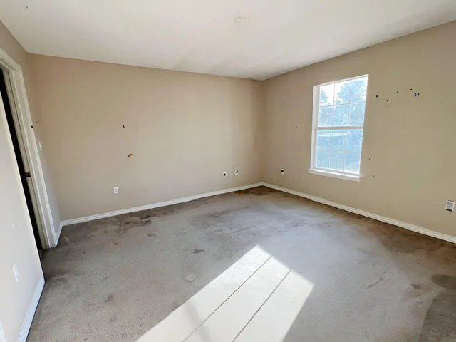 an empty room with windows