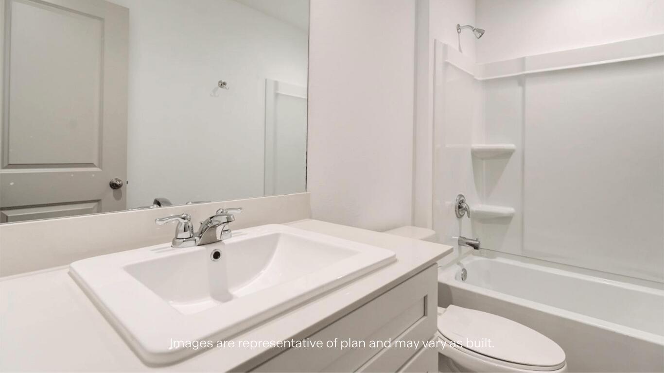 2229 150th Place Lubbock, TX 79423 - Photo 11 of 13 a bathroom with a sink toilet and bathtub