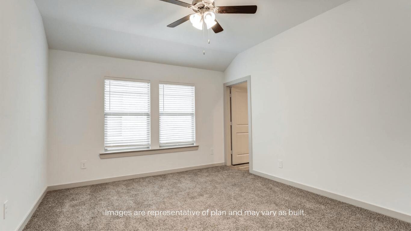 2229 150th Place Lubbock, TX 79423 - Photo 6 of 13 an empty room with windows and fan