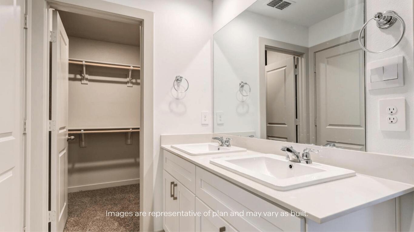 2229 150th Place Lubbock, TX 79423 - Photo 8 of 13 a bathroom with a sink a mirror and a shower
