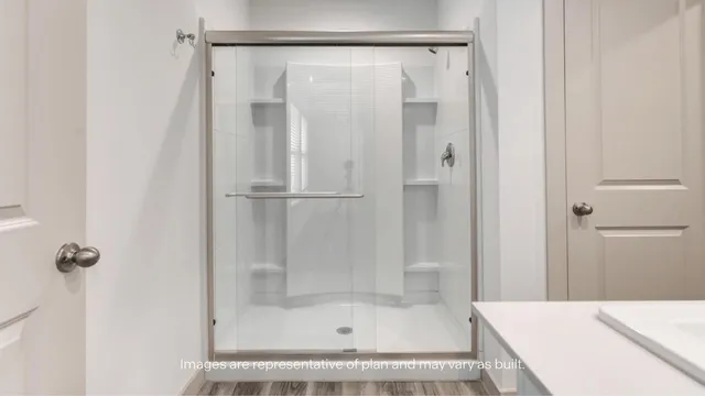 a bathroom with a shower and a bath tub