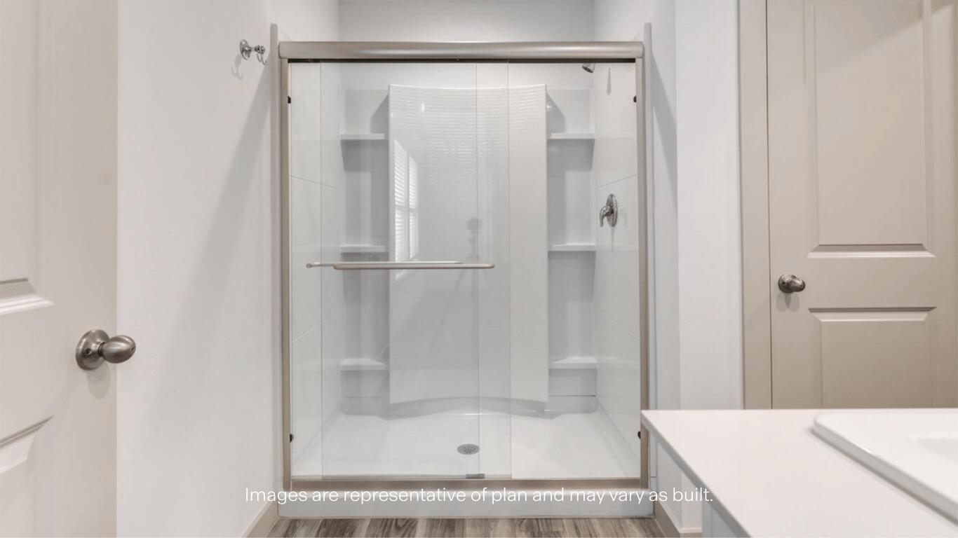 2229 150th Place Lubbock, TX 79423 - Photo 9 of 13 a bathroom with a shower and a bath tub