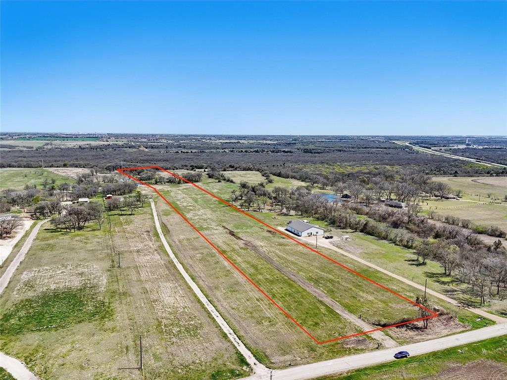 254 North Cooke Road Ennis, TX 75119 - Photo 7 of 8 an aerial view of residential houses with outdoor space