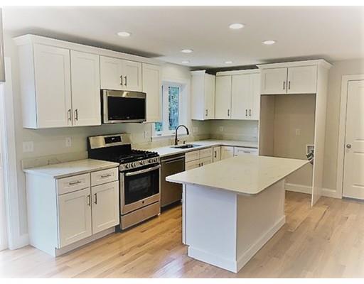 8 Littleton Road Ayer, MA 01432 - Photo 2 of 17 a kitchen with a sink a stove a refrigerator and cabinets