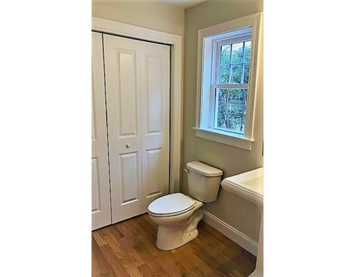 8 Littleton Road Ayer, MA 01432 - Photo 5 of 17 a bathroom with a toilet and a shower