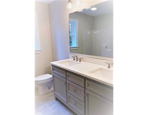 8 Littleton Road Ayer, MA 01432 - Photo 8 of 17 a bathroom with a sink a toilet and a mirror