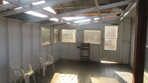 a view of a livingroom with furniture and windows