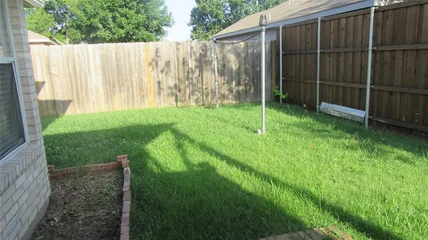 a backyard of a house with plants
