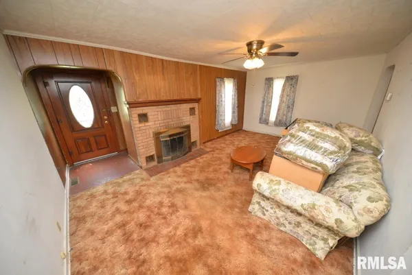 a bedroom with a bed and a fireplace