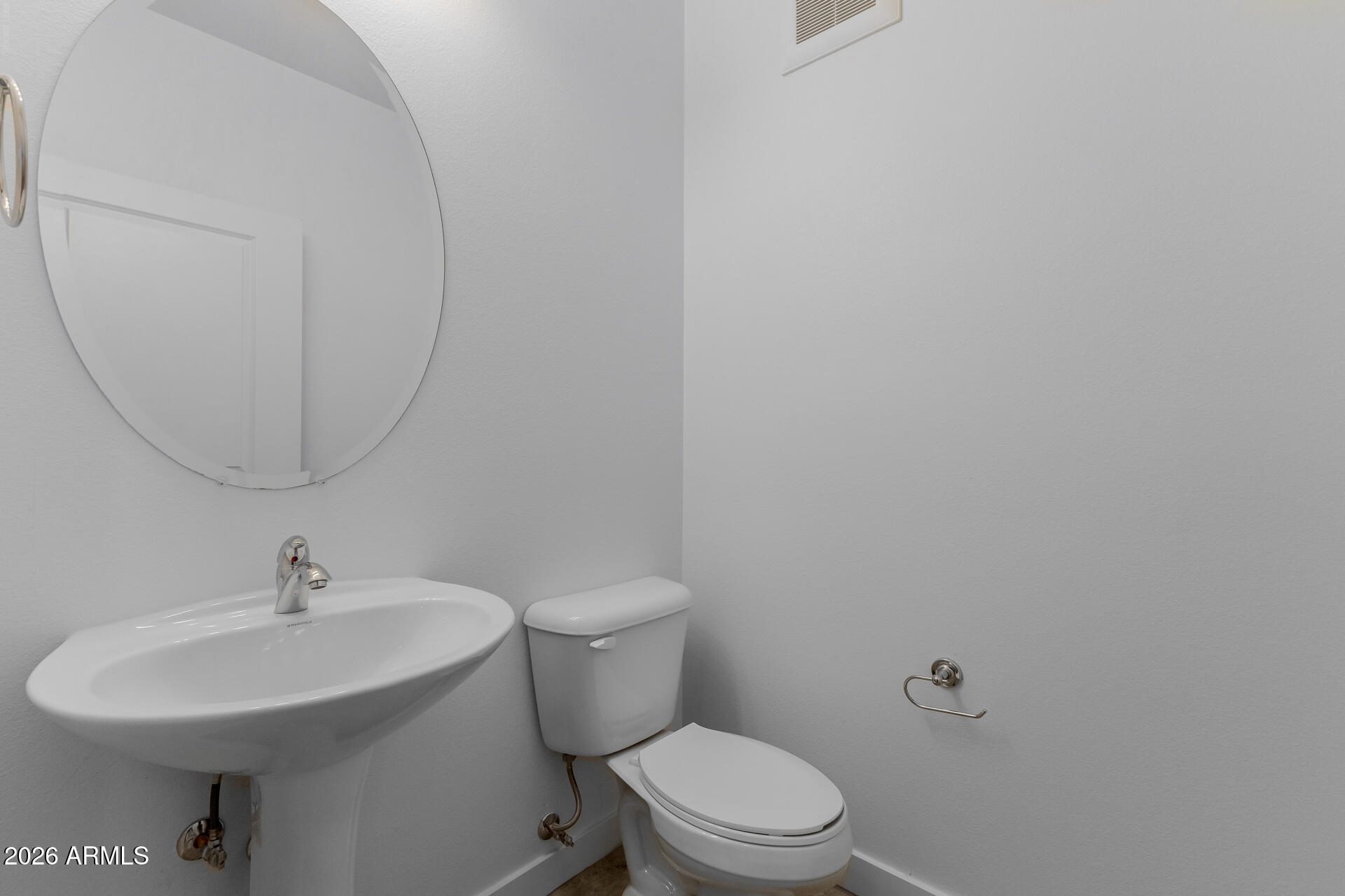 2511 West Queen Creek Road, Unit 279 Chandler, AZ 85248 - Photo 9 of 35 a bathroom with a sink a toilet and a mirror