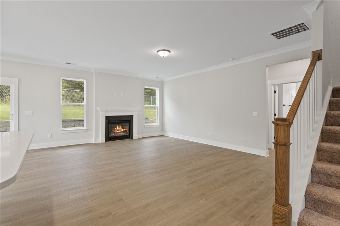 313 Old Shirley Road Central, SC 29630 - Photo 9 of 30 This inviting living area boasts a cozy fireplace and abundant natural light.