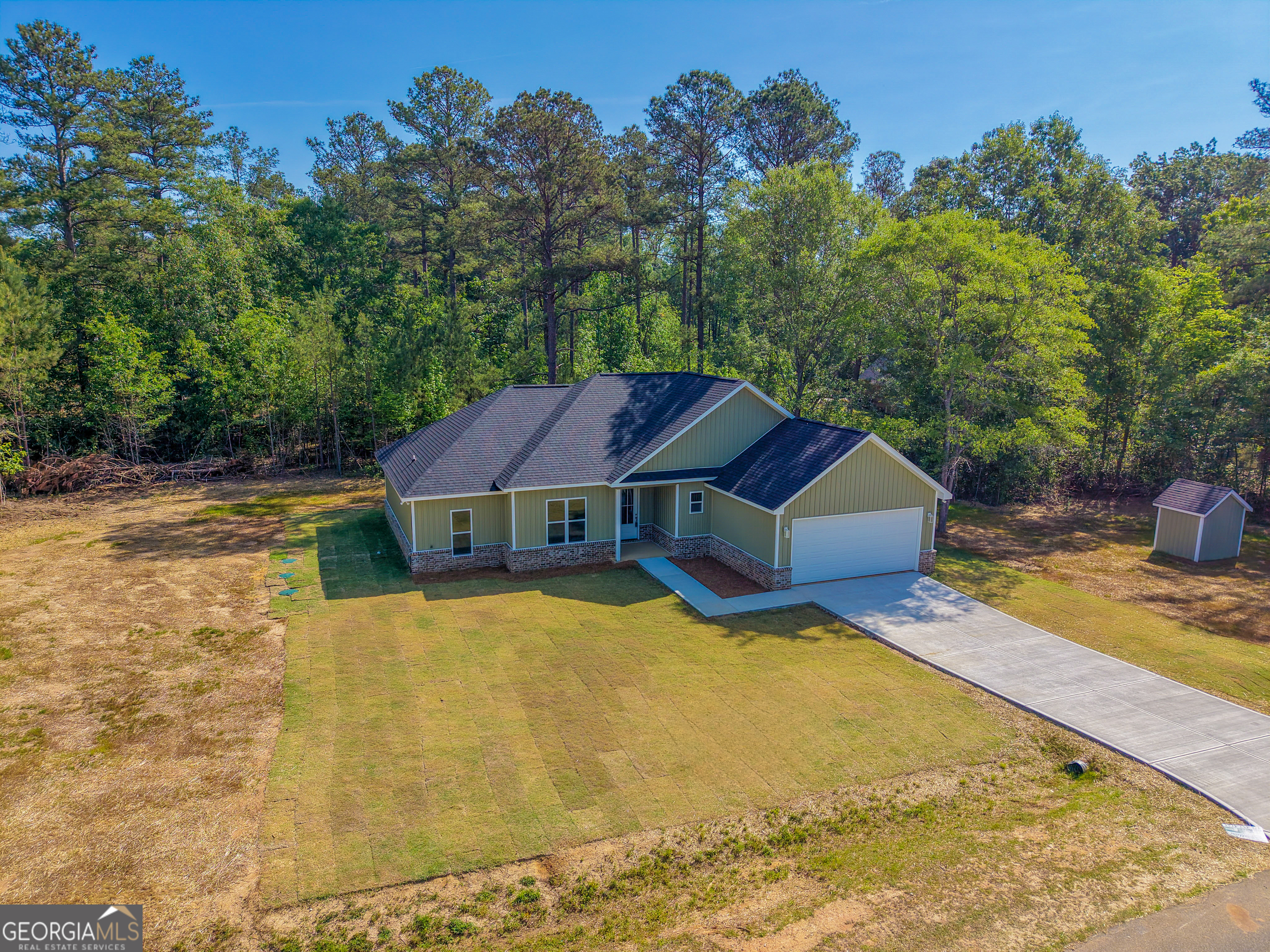 711 Flanders Lane Dublin, GA 31021 - Photo 3 of 49 a view of a house with pool plants and large trees
