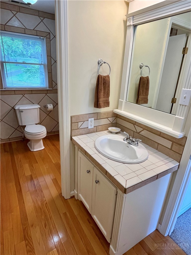 638 Ridge Road Glade Valley, NC 28627 - Photo 34 of 44 a bathroom with a sink and a mirror