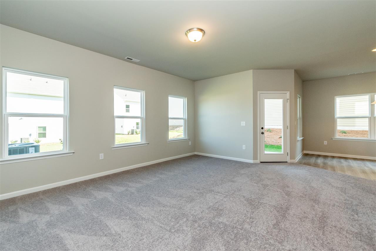 6818 Resting Grove Road, Unit 108 Raleigh, NC 27610 - Photo 13 of 24 A representative photo of a Braselton plan already built for demonstration purposes. New construction is under way. Family Room