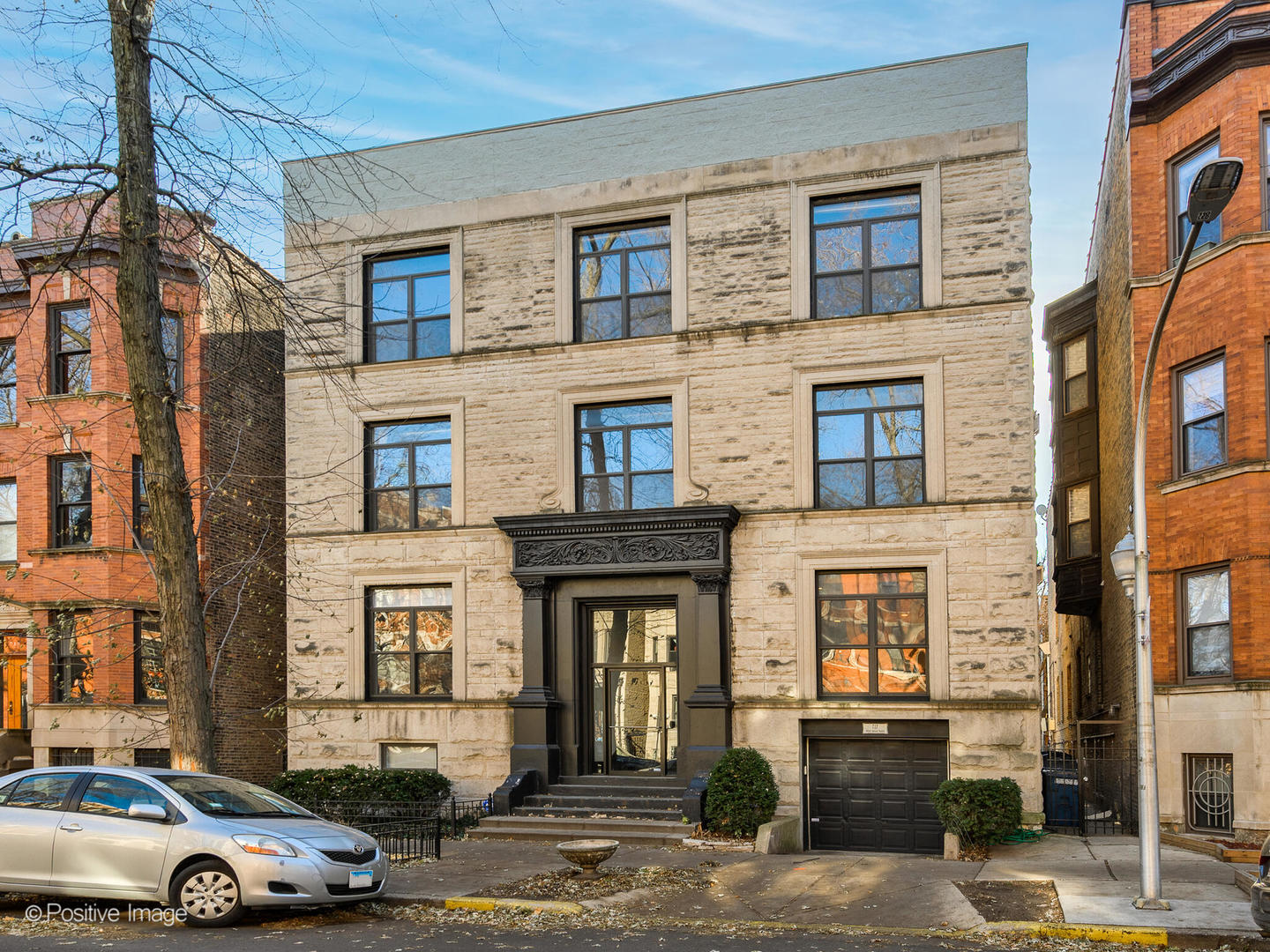 717 West Briar Place, Unit 1W Chicago, IL 60657 - Photo 1 of 17 a front view of a building with parking space