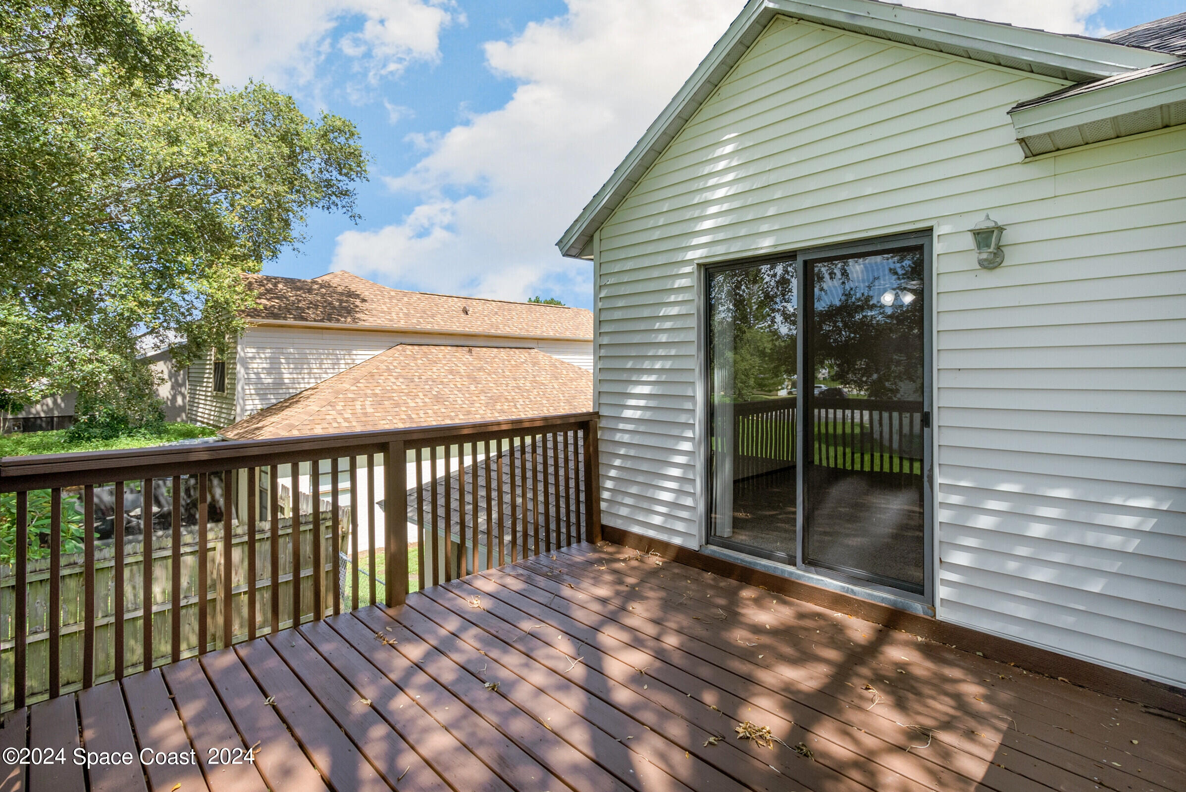 1680 Clover Circle Melbourne, FL 32935 - Photo 20 of 37 Deck off Primary Bdrm