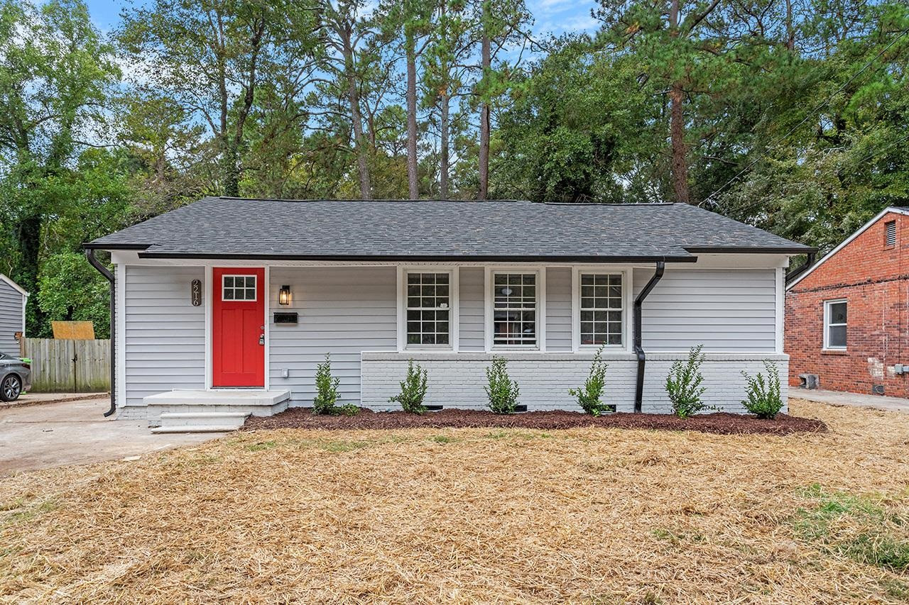 2216 Shannon Street Raleigh, NC 27610 - Photo 1 of 38 a front view of a house with garden