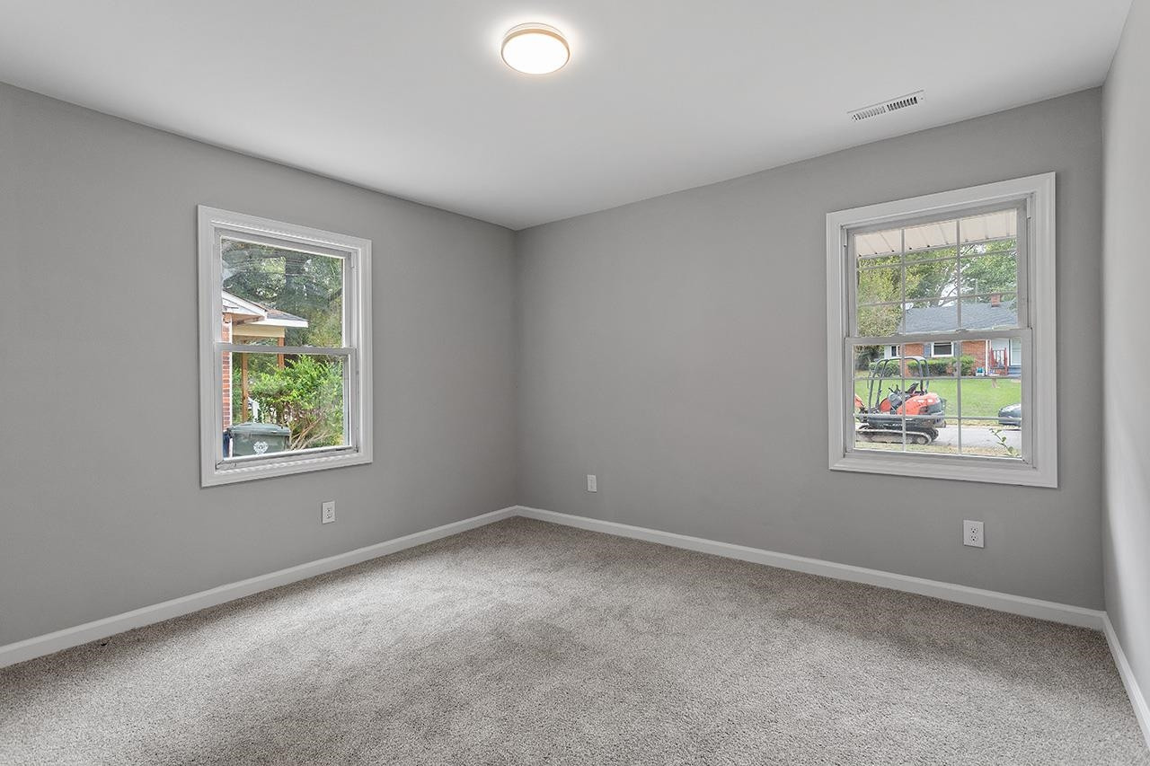 2216 Shannon Street Raleigh, NC 27610 - Photo 24 of 38 an empty room with windows