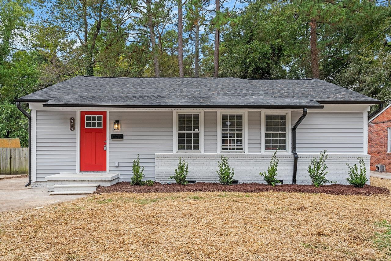 2216 Shannon Street Raleigh, NC 27610 - Photo 33 of 38 a front view of a house with garden