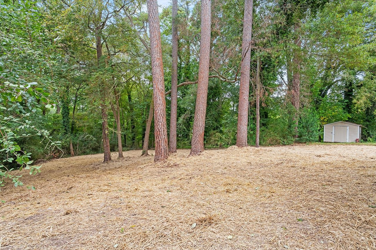 2216 Shannon Street Raleigh, NC 27610 - Photo 35 of 38 a big yard with large trees