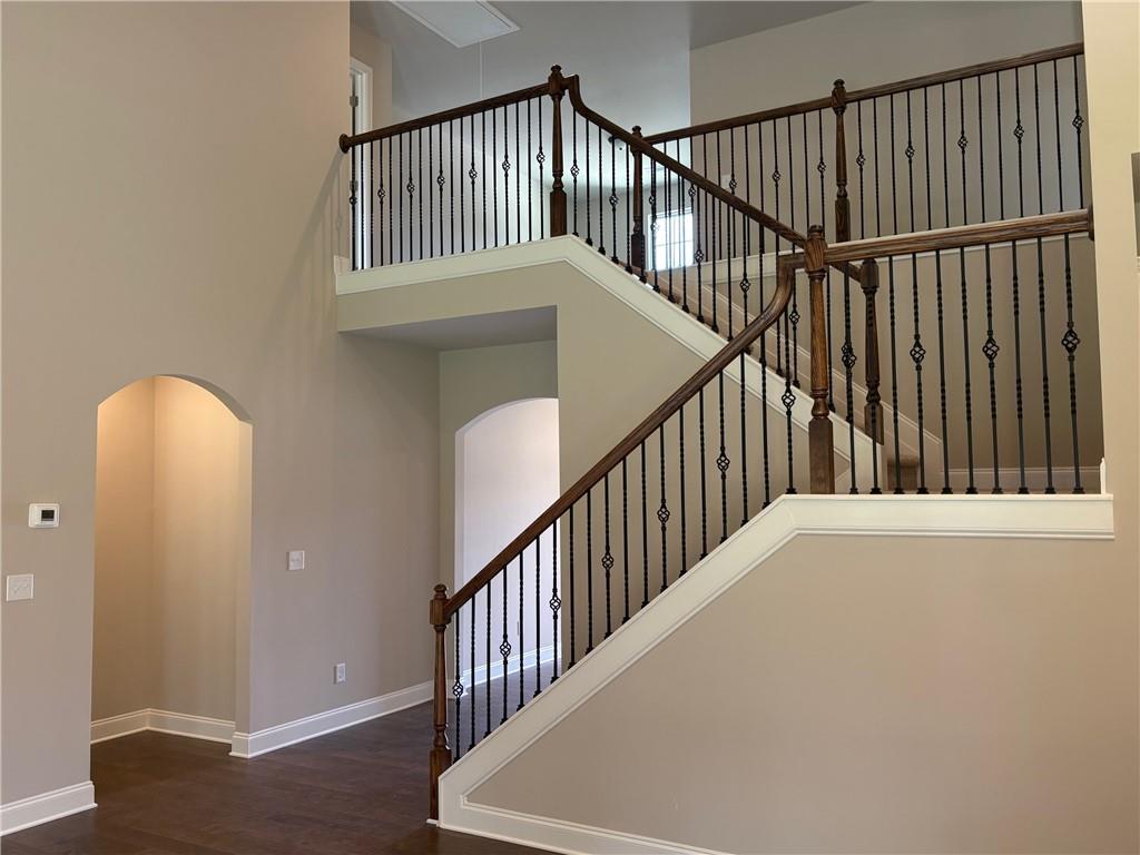 946 Lakeview Oaks Court Grayson, GA 30017 - Photo 12 of 25 a view of staircase with railing and a window