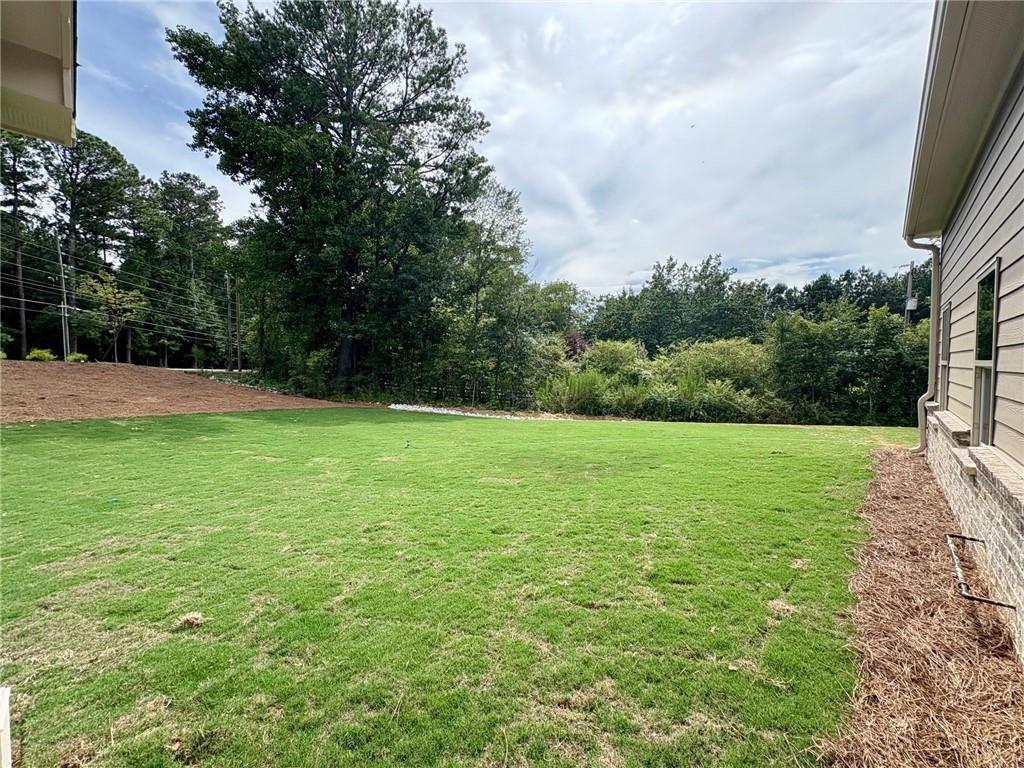 946 Lakeview Oaks Court Grayson, GA 30017 - Photo 22 of 25 a view of a field of grass and trees