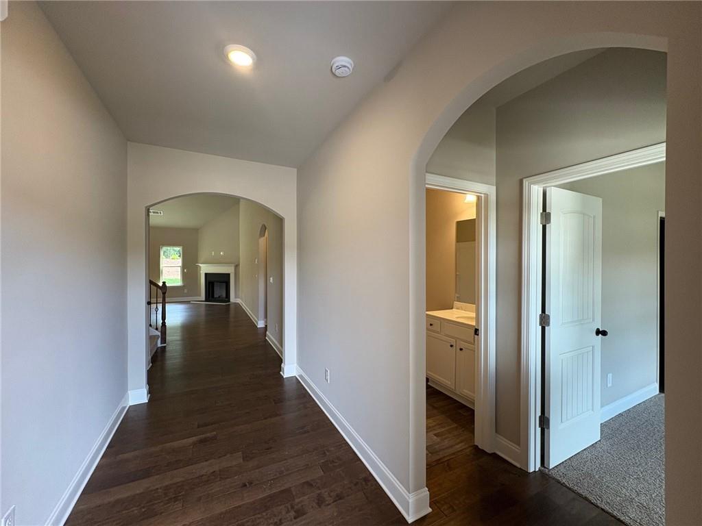 946 Lakeview Oaks Court Grayson, GA 30017 - Photo 4 of 25 a view of a hallway with wooden floor and closet