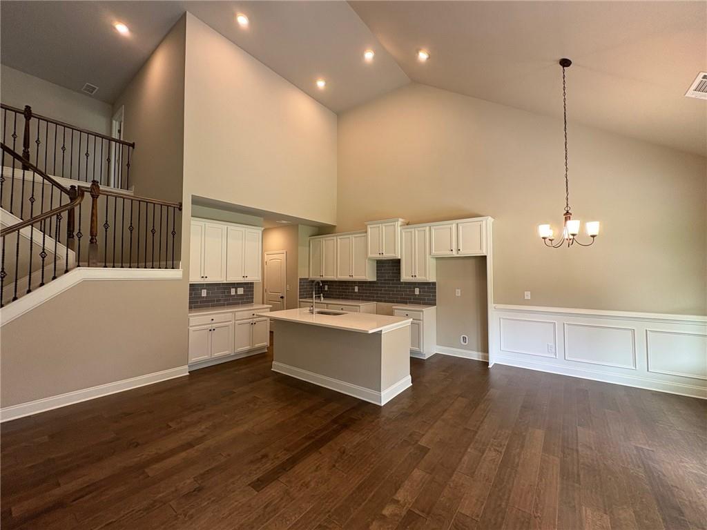 946 Lakeview Oaks Court Grayson, GA 30017 - Photo 8 of 25 a kitchen with a sink cabinets and wooden floor