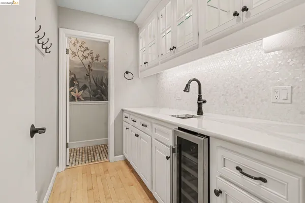 a kitchen with a sink and cabinets